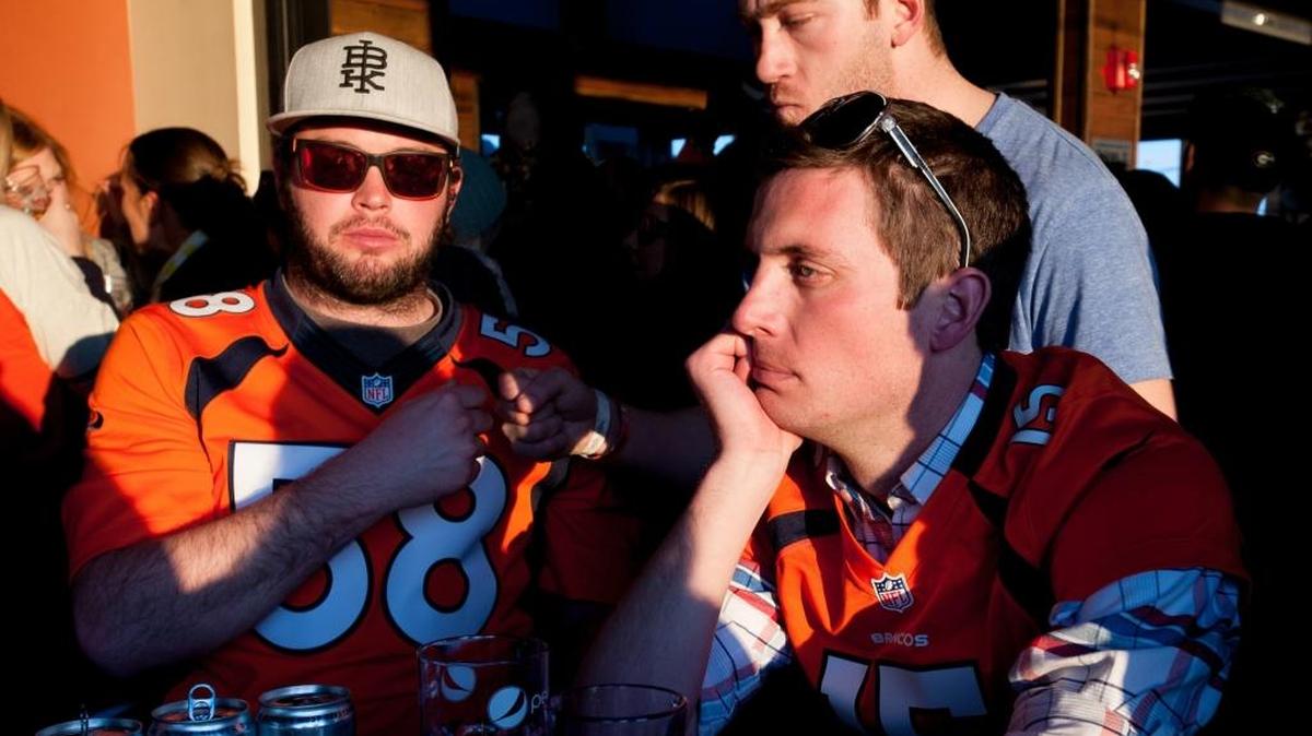 DENVER, CO - FEBRUARY 2: A Broncos fan looks disappointed as the Denver Broncos struggle in the first half of Super Bowl XLVII between the Denver Broncos and the Seattle Seahawks at the Viewhouse bar in the Lower Downtown Historic District (LoDo) on February 2, 2014 in Denver, Colorado. (Photo by Dustin Bradford/Getty Images)