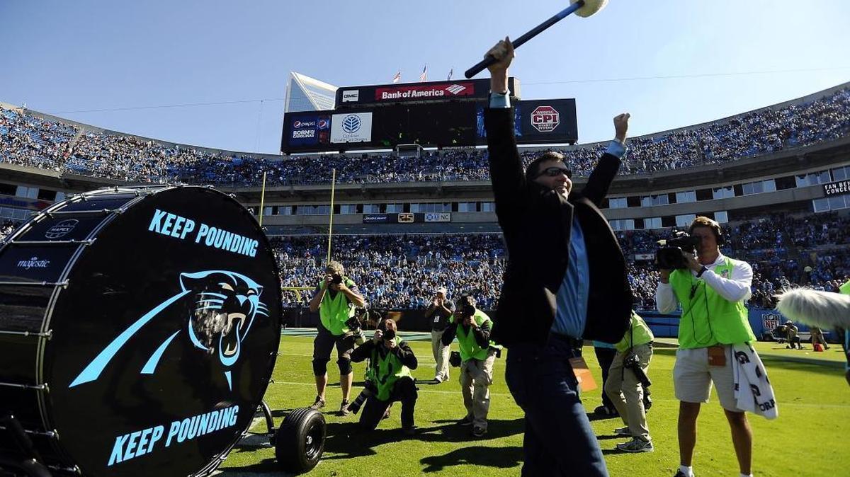 Former Carolina Panthers quarterback Jake Delhomme waves to fans after pounding the Keep Pounding drum before the Atlanta Falcons game at Bank of America Stadium on Nov. 3, 2013. The Panthers won, 34-10.