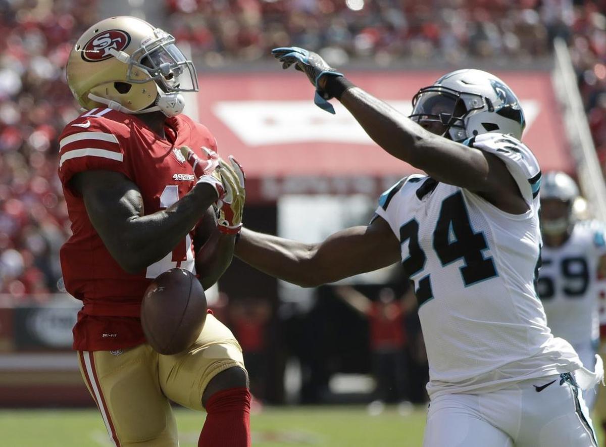 San Francisco 49ers wide receiver Marquise Goodwin (11) cannot catch a pass as he is defended by Carolina Panthers cornerback James Bradberry (24) during the first half of an NFL football game in Santa Clara, Calif., Sunday, Sept. 10, 2017. (AP Photo/Marcio Jose Sanchez)