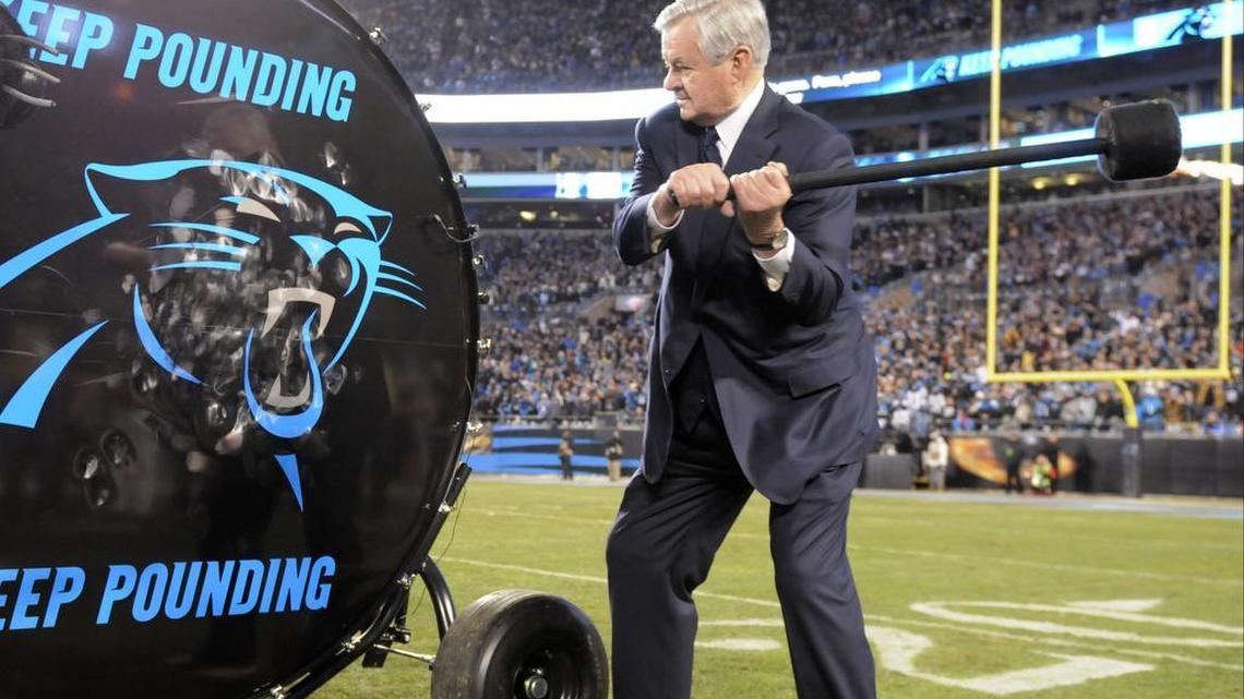 Carolina Panthers owner Jerry Richardson hits a drum before the NFL football NFC Championship game against the Arizona Cardinals on Sunday.