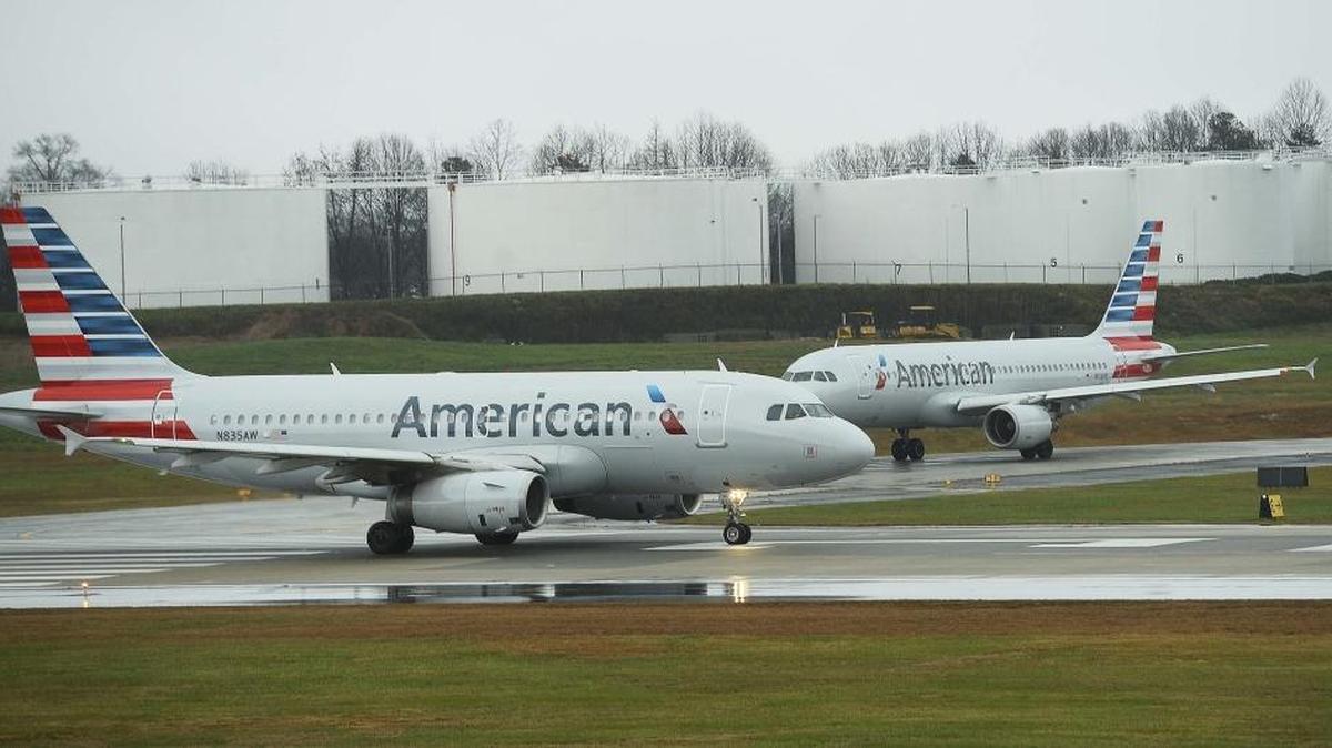 An American Airlines jet heads down the runway for take off at Charlotte Douglas International airport on Dec. 23, 2015.