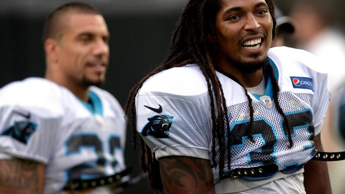Carolina Panthers safety Tre Boston, right, jokes with wide receiver Philly Brown along the sideline during practice at Bank of America Stadium on Aug. 5 Charlotte during Fan Fest.