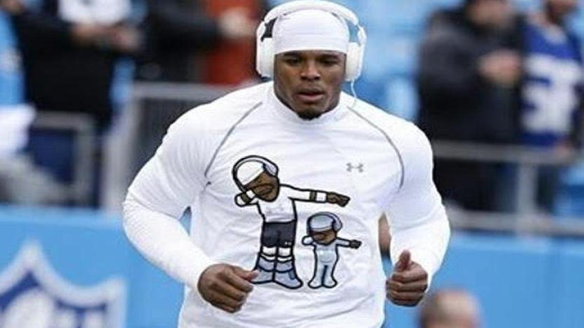 Cam Newton warms up Sunday before the playoff game in Charlotte against the Seattle Seahawks. The design by a Charlotte company is getting loads of attention.