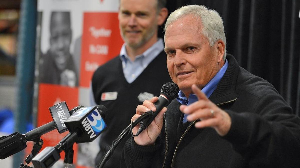 Rick Hendrick, right, speaks to the media in a 2014 file photo.