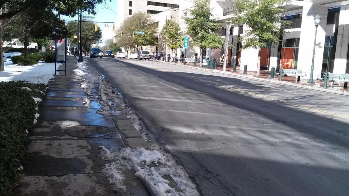 Charlotte officials say while crews have spent time clearing sidewalks near Bank of America Stadium, fans headed to the Panthers-Cardinals game should still watch out for slippery spots in some areas.