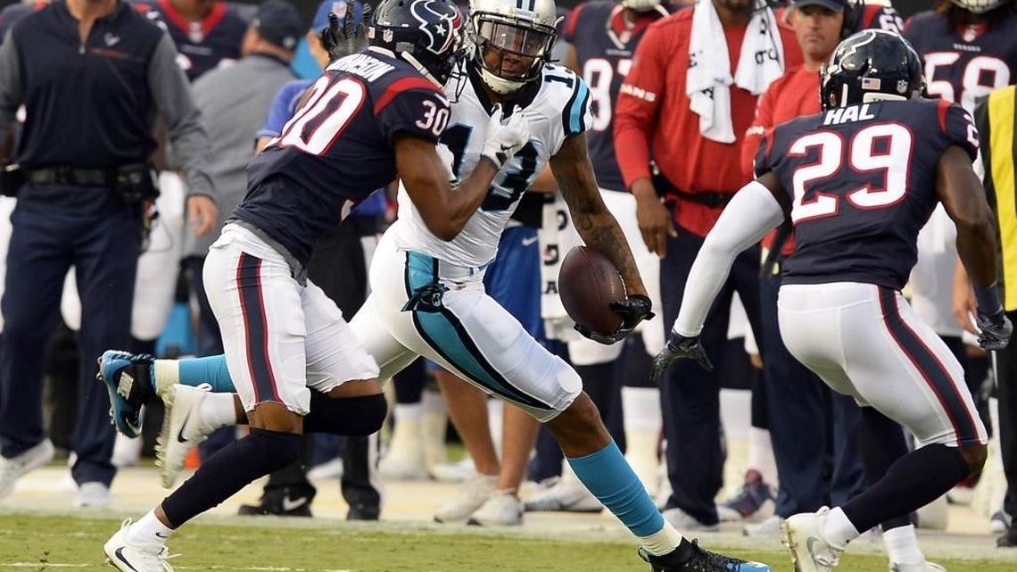 Carolina Panthers wide receiver Kelvin Benjamin (13) fends off Houston Texans cornerback Kevin Johnson (30) and free safety Andre Hal (29) after making a reception in the first half in their preseason game at Bank of America Stadium on Wednesday, August 9, 2017. The Panthers led 17-10 at halftime.