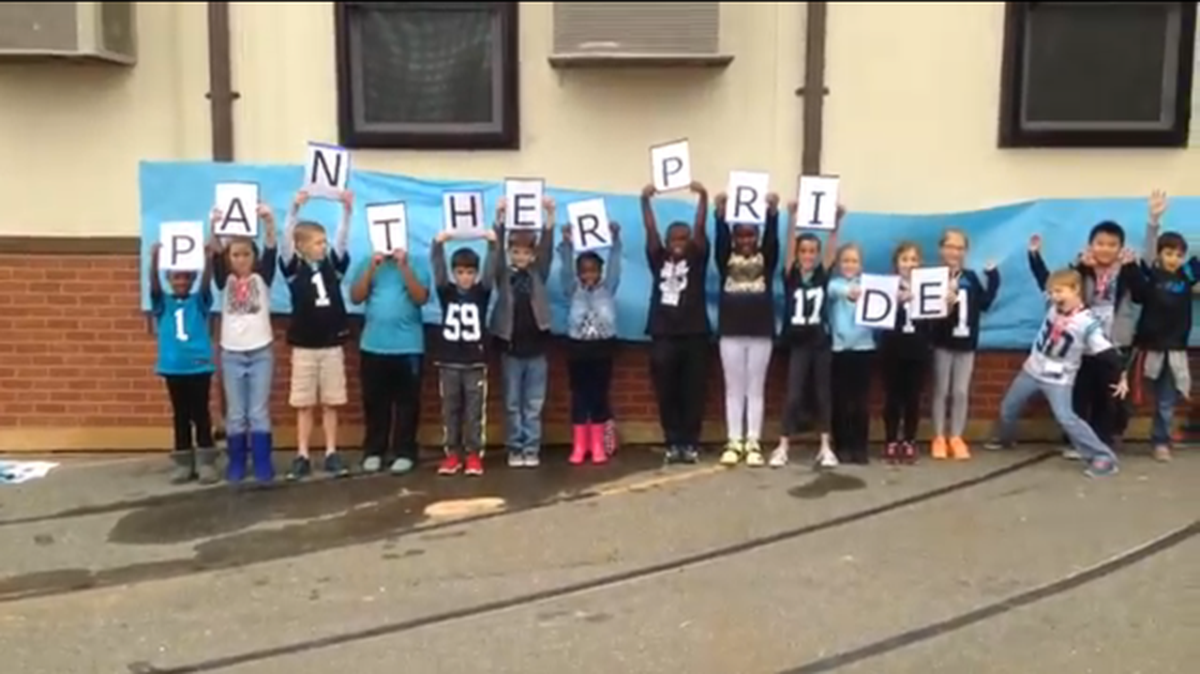 Third-graders at Mountain Island Lake Academy display Panthers pride in a video.