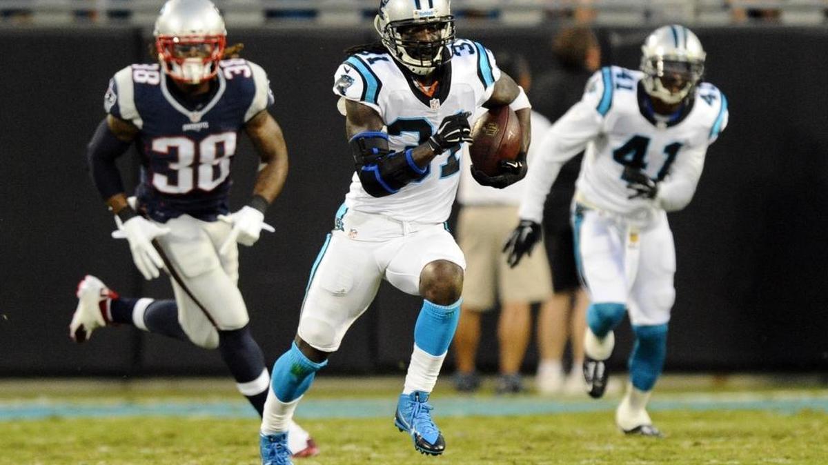 Carolina Panthers’ Charles Tillman (31) heads upfield after intercepting a New England Patriots' Tom Brady pass during the first half in their preseason game at Bank of America Stadium on August 28, 2015.