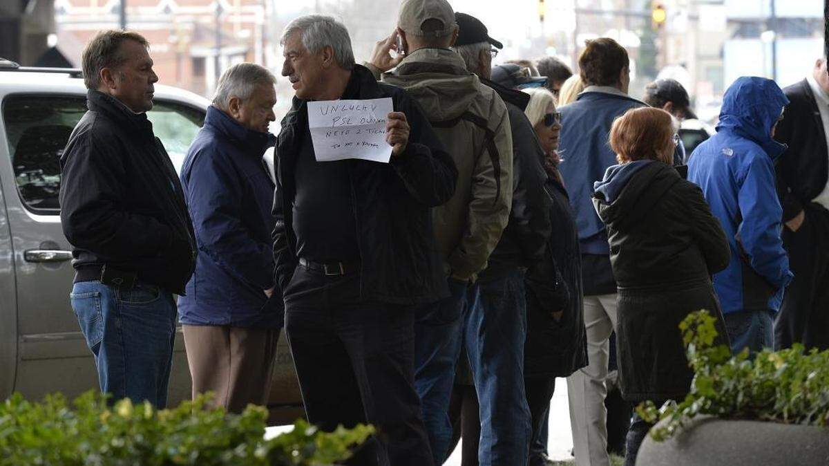 People line up outside of Bank of America stadium to purchase Super Bowl tickets.