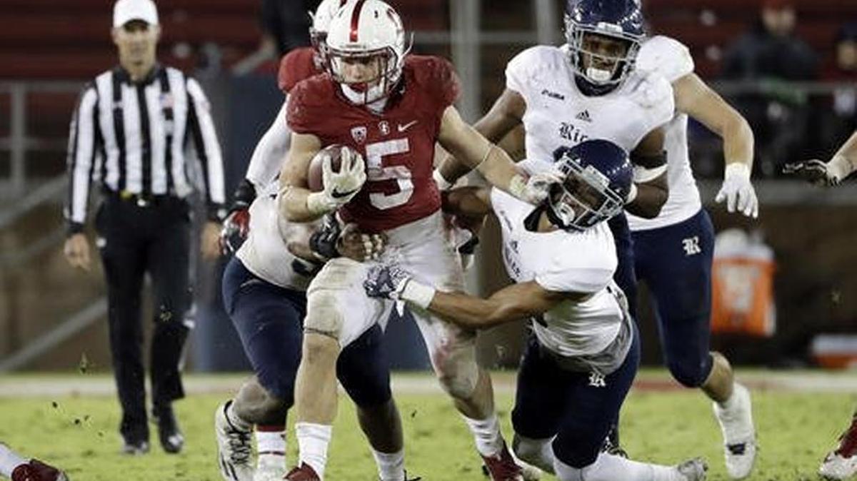 Stanford running back Christian McCaffrey, center, holds the NCAA record for most all-purpose yards in a season with 3,864.