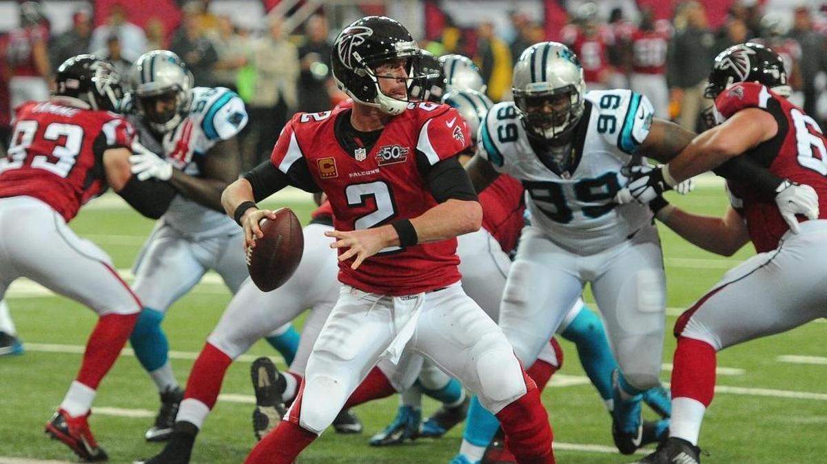 Atlanta Falcons quarterback Matt Ryan stands in the pocket as the Carolina Panthers defense rushes during second quarter action at the Georgia Dome on Sunday, December 27, 2015 in Atlanta, GA. The Falcons defeated the Panthers 20-13.