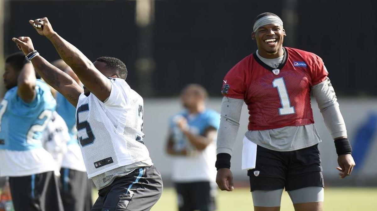 Panthers QB Cam Newton (right) gave his thoughts on the Colin Kaepernick situation in an interview with ESPN.