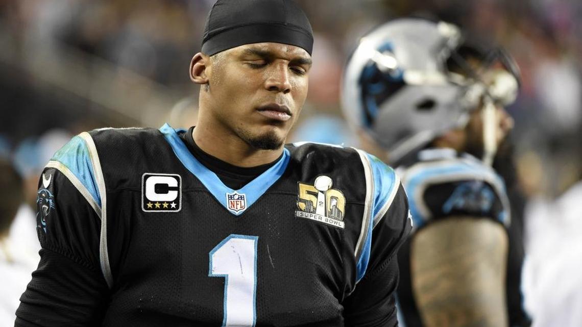 Carolina Panthers quarterback Cam Newton looks pained as he walks the sideline as the Denver Broncos run the clock down in the fourth quarter in Super Bowl 50.