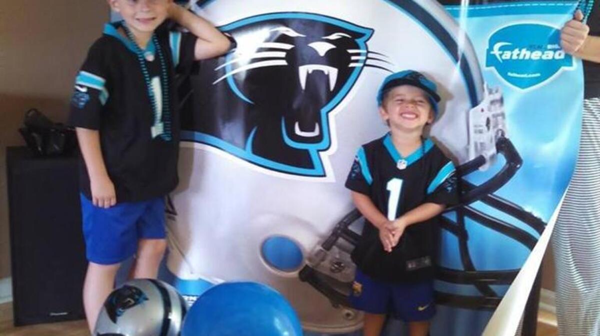 Holmes, Vincent and Clare Desmelik pose in their Brevard home.