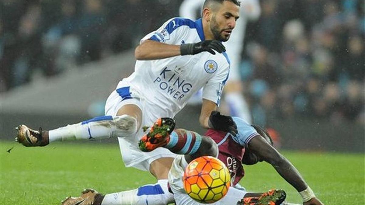 eicester City’s Riyad Mahrez, left, is tackled by Aston Villa’s Idrissa Gana during the English Premier League soccer match between Aston Villa and Leicester City at Villa Park, Birmingham, England, Saturday, Jan. 16 2016.