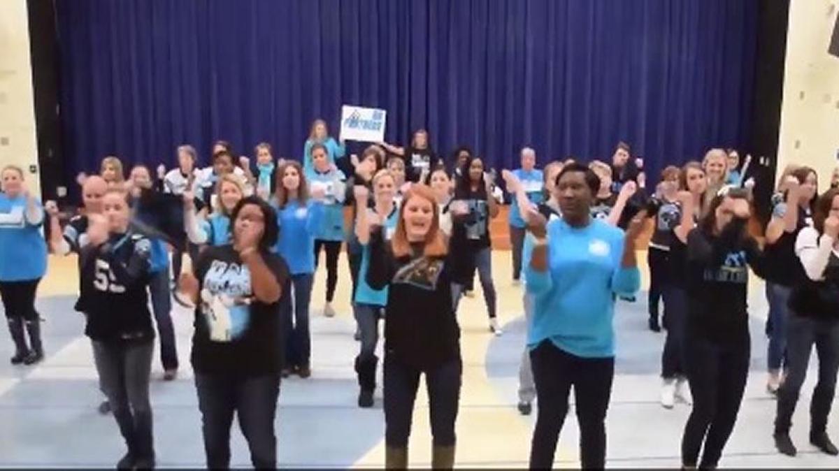 A screen shot of staffers at Sharon Elementary School dancing to Drake’s “Big Rings” as a show of support to the Carolina Panthers.
