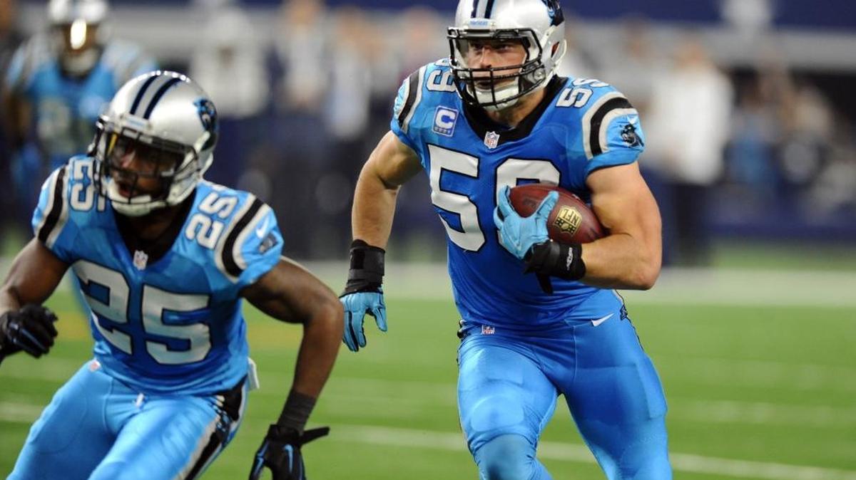 Carolina Panthers' Luke Kuechly (59) heads upfield to score a touchdown after intercepting a Dallas Cowboys' Tony Romo (9) pass in the second quarter at AT&T Stadium on Thursday, November 26, 2015. The Panthers won 33-14 and improved to 11-0.