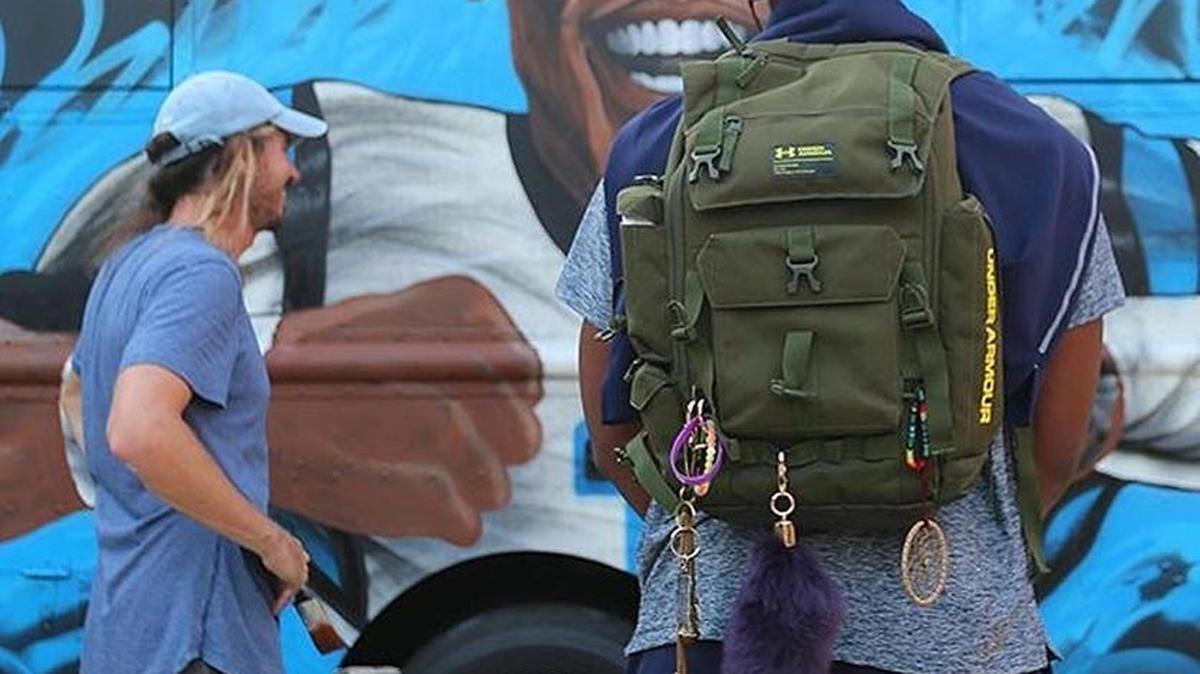 Cam Newton standing in front of his food truck, Smokn’ Aces.