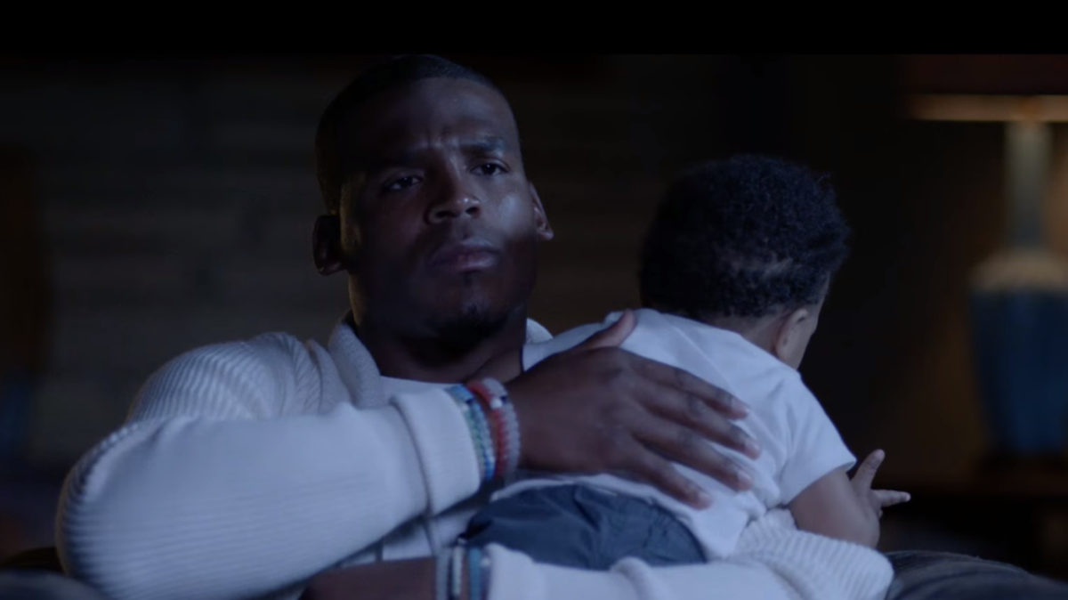Gatorade’s new ad shows a scene of Carolina Panthers quarterback Cam Newton cradling his young son, Chosen.