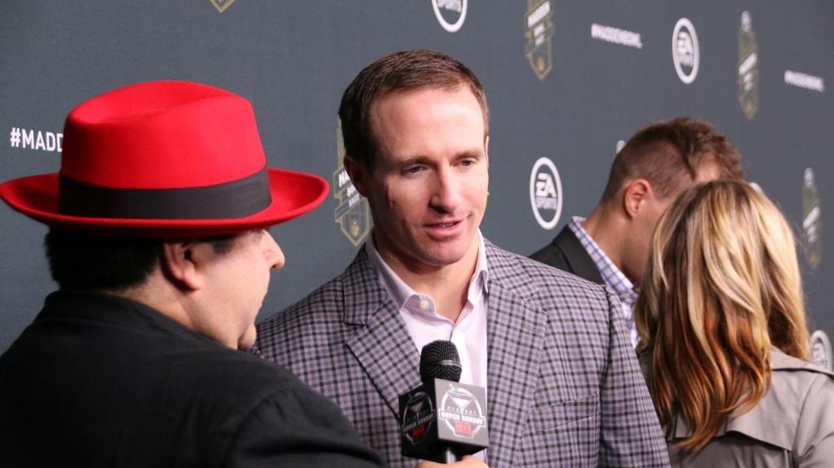 New Orleans Saints quarterback Drew Brees works his way down the red carpet at the Madden Bowl XXII Super Bowl pre-party Thursday night.