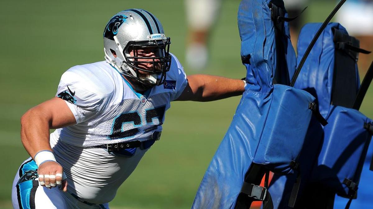 
Carolina Panthers center Ryan Kalil hits the pads during a drill on Sunday, Aug. 2, 2015 at Wofford College in Spartanburg, S.C.
