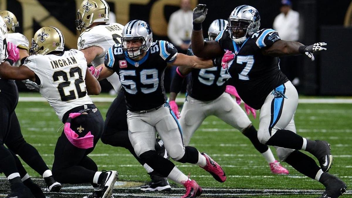 Carolina Panthers linebacker Luke Kuechly, center and defensive tackle Kyle Love, right, chase after New Orleans Saints running back Mark Ingram, left, during third quarter action at the Mercedes-Benz Superdome on Sunday, October 16, 2016 in New Orleans, LA. The Saints defeated the Panthers 41-38.