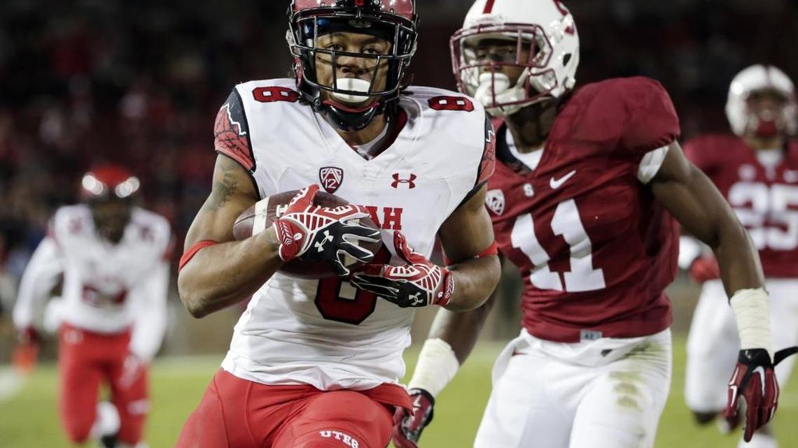 Former Utah wide receiver Kaelin Clay, center, scores on a touchdown pass against Stanford in November 2014. Friday, Clay signed a one-year deal with the Carolina Panthers.