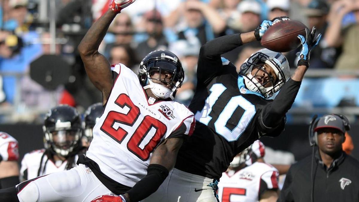 Carolina Panthers' Corey Brown (10) makes a reception past \Atlanta Falcons' Phillip Adams (20) late in the second quarter at Bank of America Stadium on Sunday, December 13, 2015. The Panther lead 28-0, at halftime.