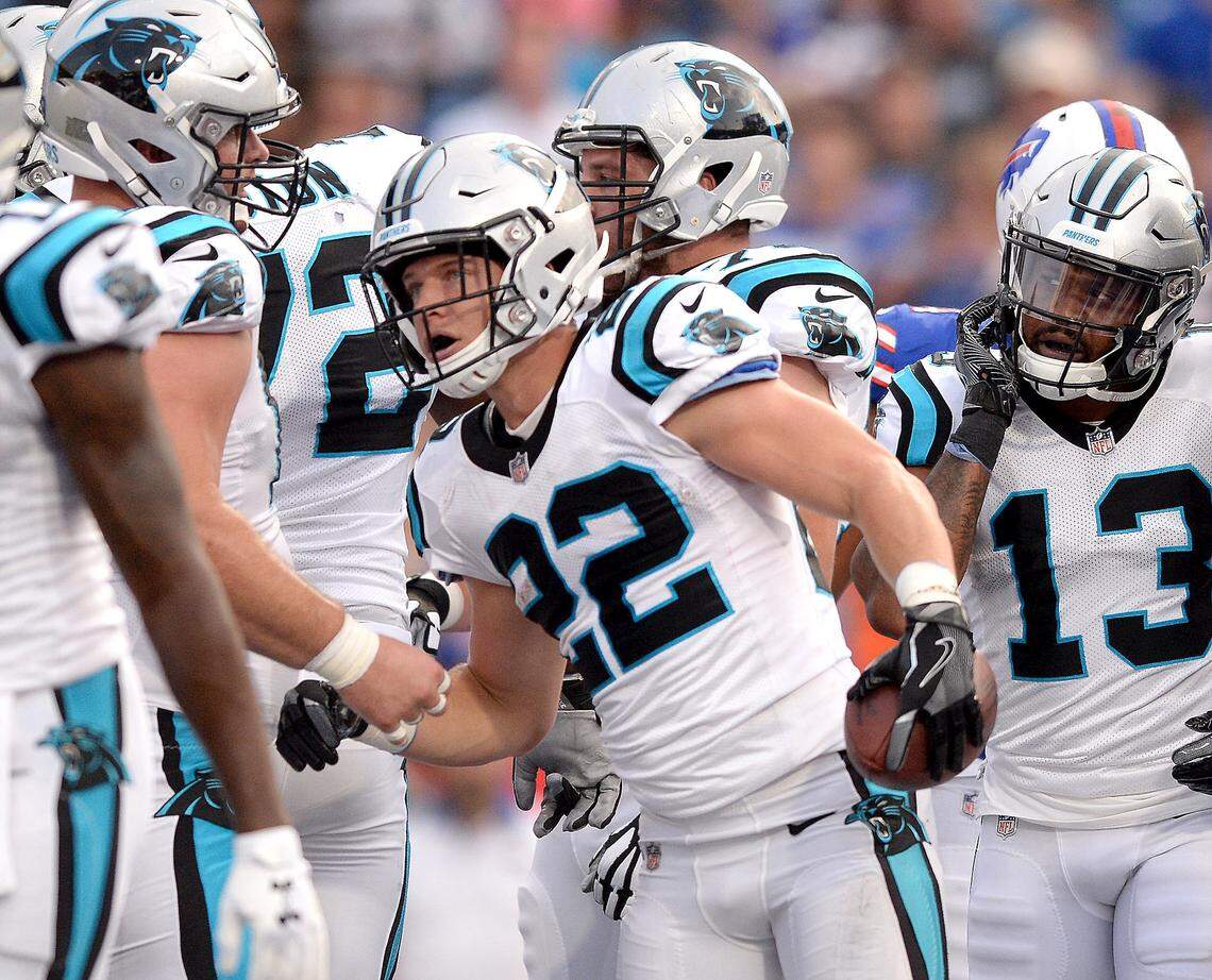Carolina Panthers running back Christian McCaffrey, center, is congratulated on his touchdown run during NFL exhibition action against the Buffalo Bills at New Era Field in Orchard Park, NY on Thursday, August 9, 2018.