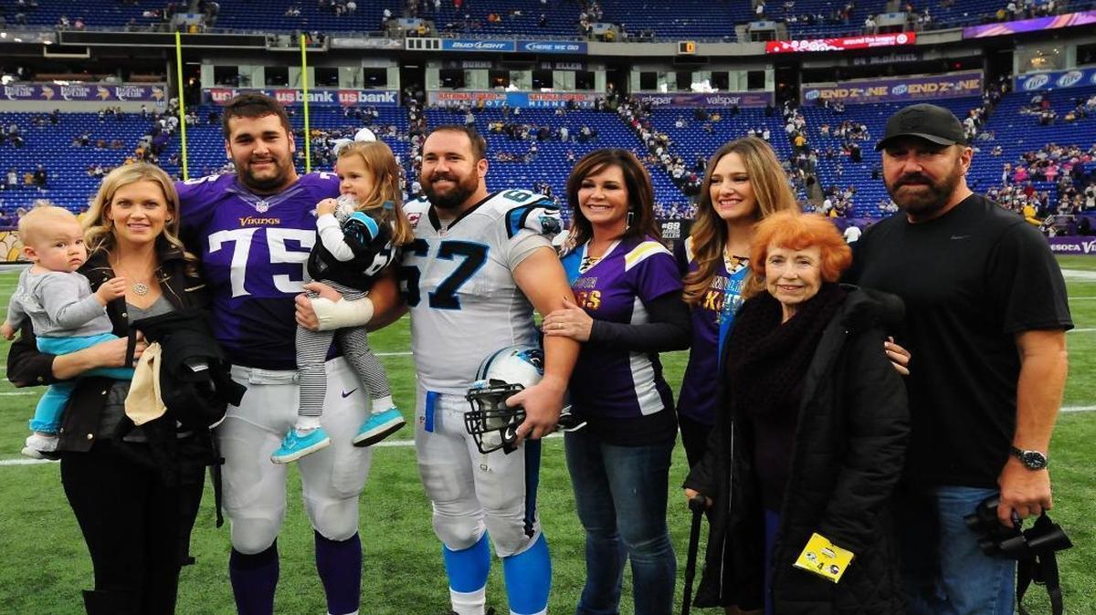 Carolina Panthers center Ryan Kalil (67) and his brother, Minnesota Vikings tackle Matt Kalil (75) pose with family members after their teams met in Minneapolis in 2013. Now the brothers are Panthers teammates.