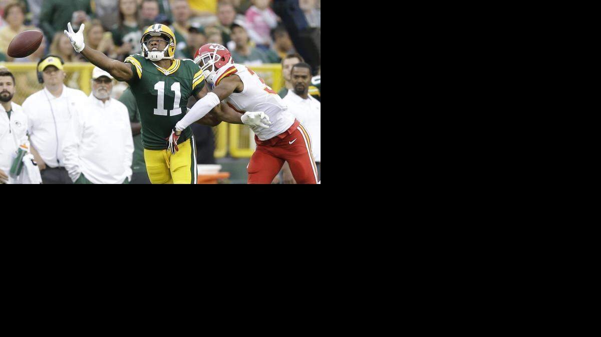 
Kansas City Chiefs' Marcus Cooper breaks up a pass intended for Green Bay Packers' Jarrett Boykin (11). Boykin, a free agent, will visit the Panthers on Wednesday, according to an ESPN.com report.
