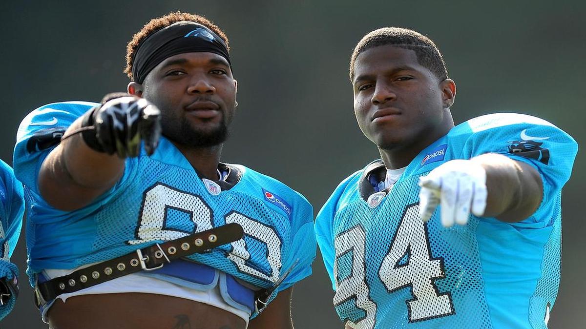 
Carolina Panthers defensive ends Frank Alexander, left, and Kony Ealy, right, posebefore practice on Monday. The two are competing to replace Greg Hardy as the starter at right defensive end. 
