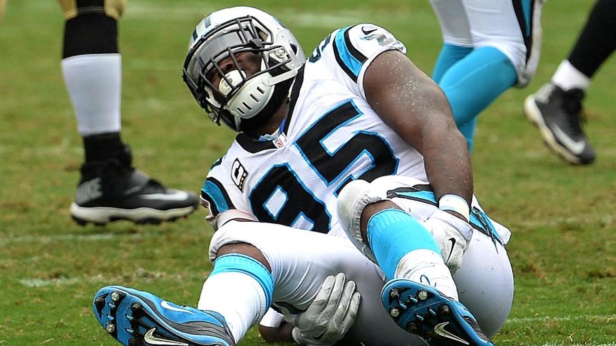 
Carolina Panthers defensive end Charles Johnson grabs the back of his right leg following a play against the New Orleans Saints during third-quarter action on Sunday at Bank of America Stadium in Charlotte. The Panthers defeated the Saints 27-22.
