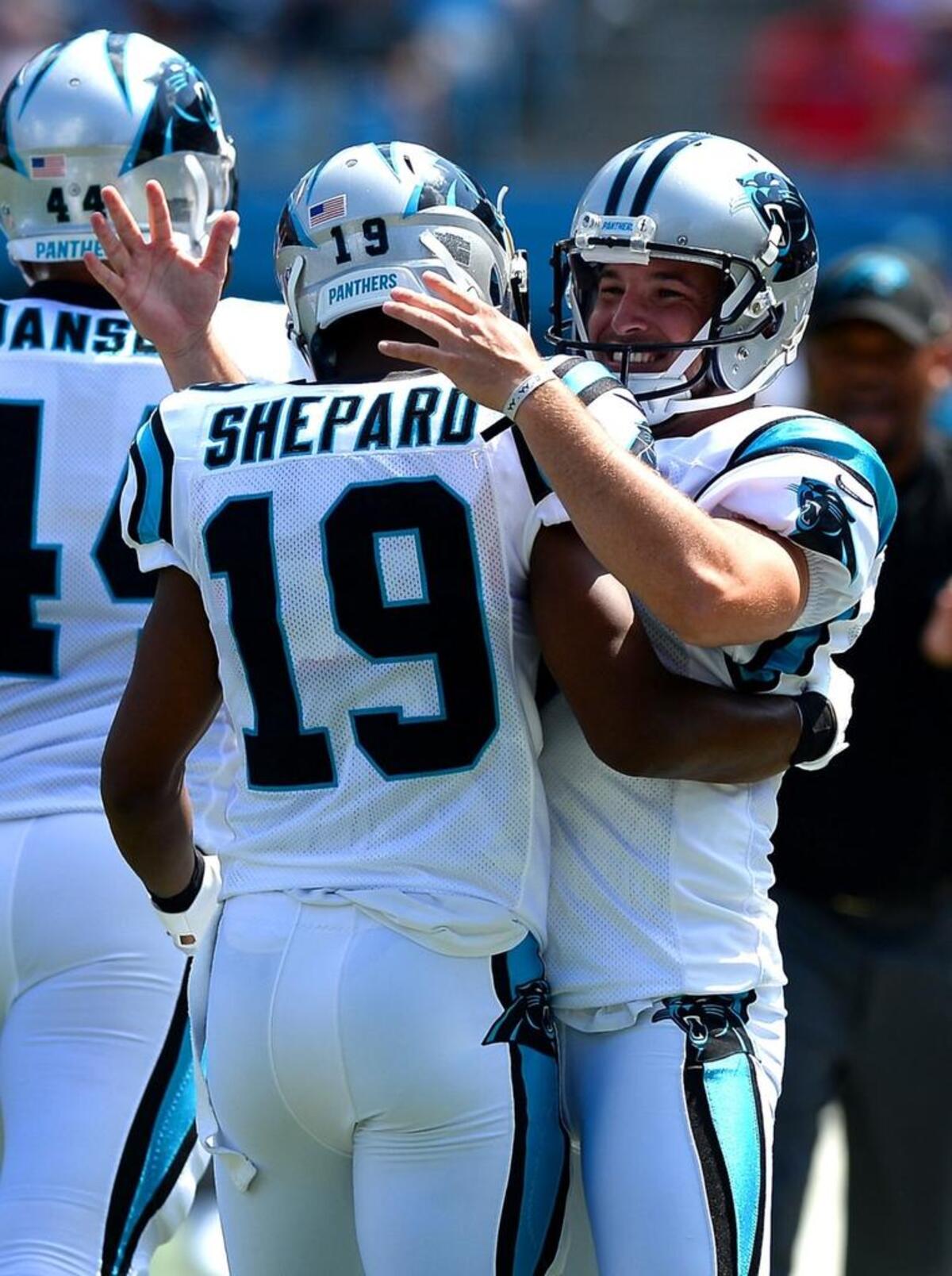 Carolina Panthers wide receiver Russell Shepard, left, is congratulated by punter Michael Palardy, right, after Shepard knocked the ball down inside the 5-yard line during the second quarter against the Buffalo Bills on Sunday. The Panthers won 9-3.