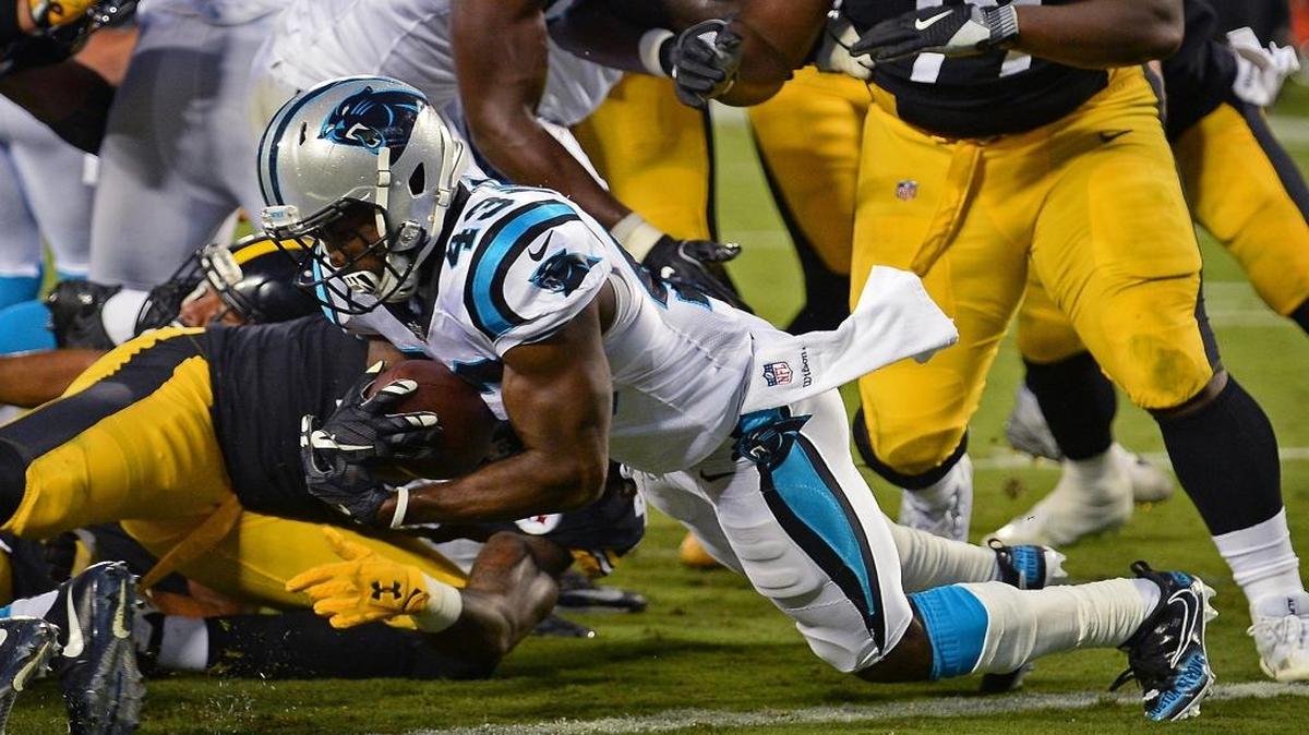 Carolina Panthers running back Fozzy Whittaker scores a touchdown against the Pittsburgh Steelers during the first quarter of Thursday’s preseason game at Bank of America Stadium in uptown Charlotte.