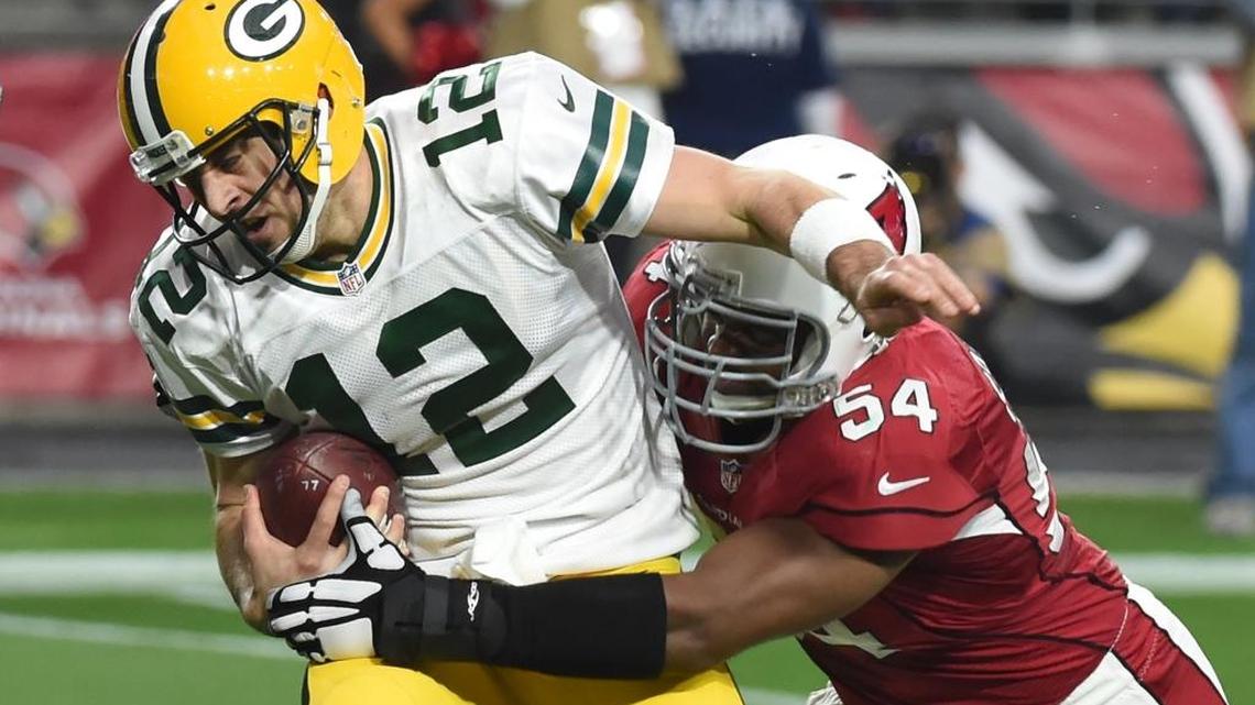 Cardinals linebacker Dwight Freeney (54) has come off the couch for eight sacks in 11 games with Arizona, including this one of quarterback Aaron Rodgers of the Green Bay Packers.