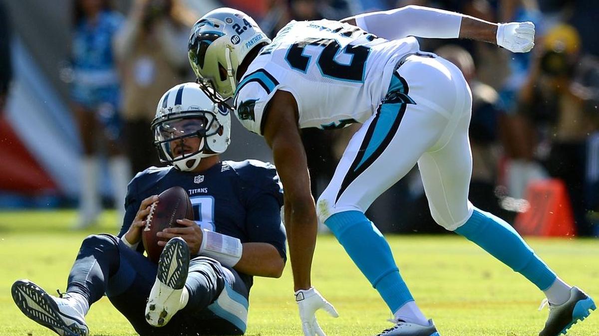 Tennessee Titans quarterback Marcus Mariota sits on the turf after being tackle by Carolina Panthers cornerback Josh Norman during the first quarter Sunday at Nissan Stadium in Nashville, Tenn. on Sunday. The Panthers defeated the Titans 27-10.