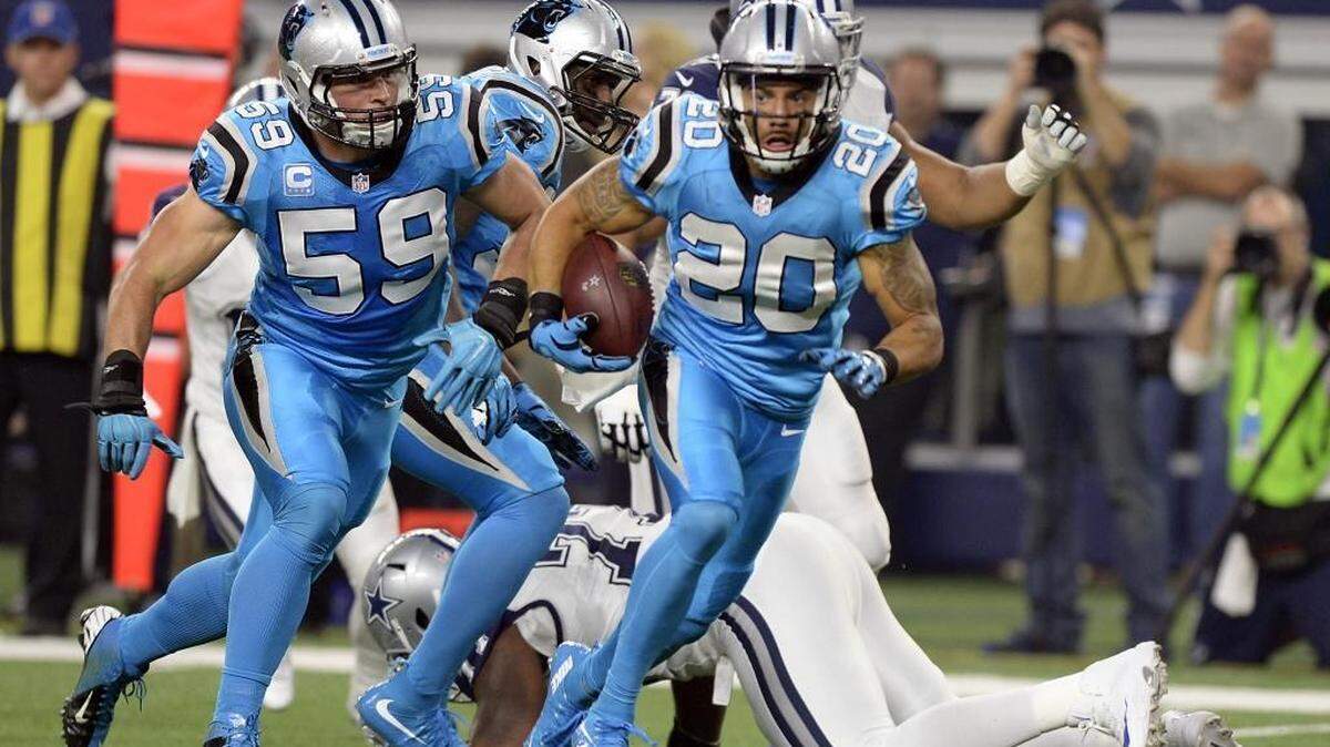 Carolina Panthers safety Kurt Coleman (20) looks to score a touchdown after intercepting a Dallas pass in the first quarter at AT&T Stadium on Thursday.