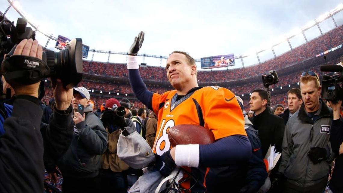 Denver Broncos quarterback Peyton Manning walks off the field after defeating the New England Patriots, 20-18, in Sunday’s AFC Championship game at Sports Authority Field at Mile High in Denver. The Broncos will face the Arizona - Carolina winner in Super Bowl 50.