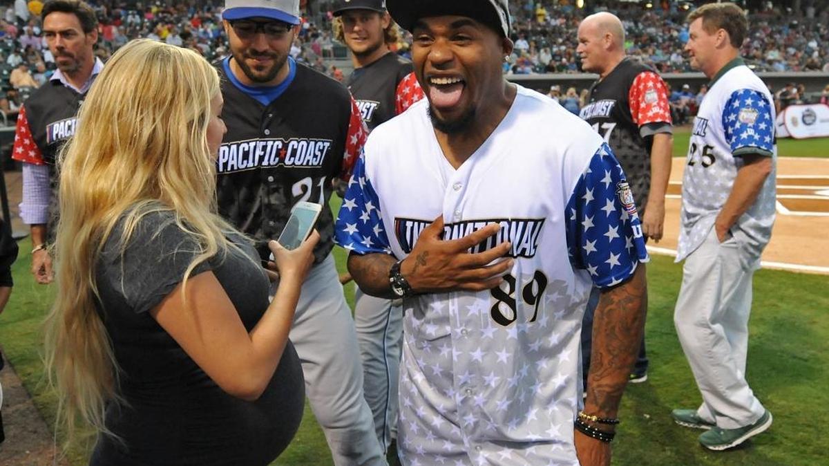 Baltimore Ravens wide receiver Steve Smith jokes with spectators along the BB&T Ballpark field prior to the start of the 2016 Triple-A Home Run Derby in Charlotte, NC on Monday, July 11, 2016.