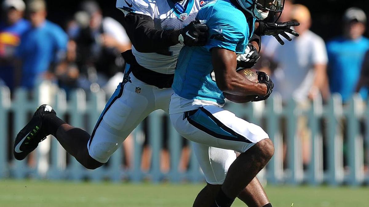 
Carolina Panthers wide receiver Devin Funchess, left, looks to make the stop on cornerback Carrington Byndom, right, after Byndom intercepted a pass during practice on  Aug. 2, 2015 at Wofford College in Spartanburg, S.C.
