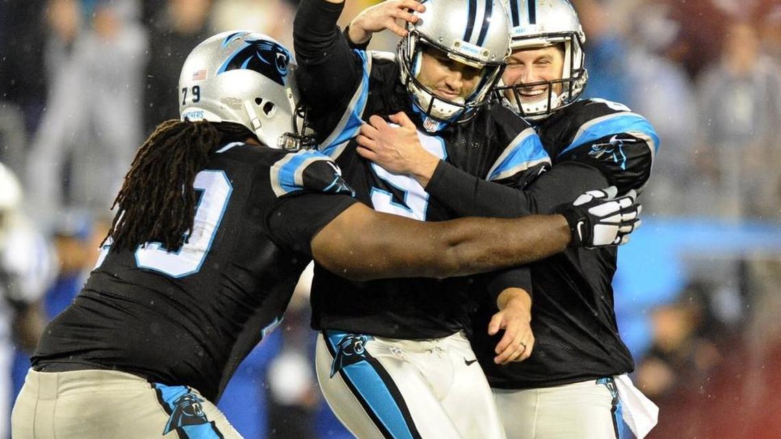 Carolina Panthers' Graham Gano (9) is congratulated by Chris Scott (79) and Brad Nortman (8) after hitting the game-winning field goal in overtime against the Indianapolis Colts on Monday, Nov. 2, 2015, at Bank of America Stadium in Charlotte, N.C. (David T. Foster III/Charlotte Observer/TNS).