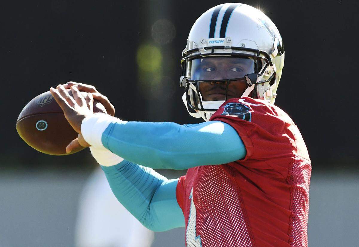 Carolina Panthers quarterback Cam Newton (1) drops back for a pass during organized team activities on Monday, June 4, 2018.