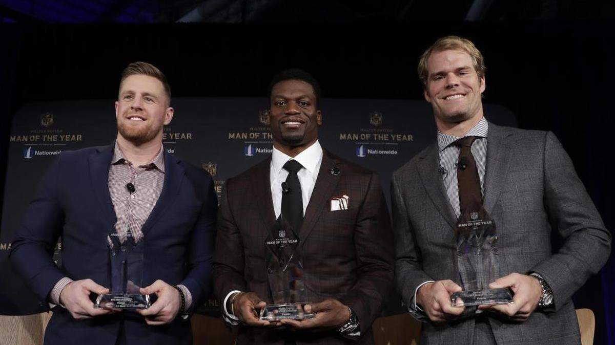 Houston Texans defensive end J.J. Watt, left, who raised $37 million in three weeks for Hurricane Harvey recovery efforts in Houston, won the Walter Payton Man of the Year award on Saturday night. The Baltimore Ravens’ Benjamin Watson and Carolina Panthers’ Greg Olsen were also finalists for the the award that recognizes community service