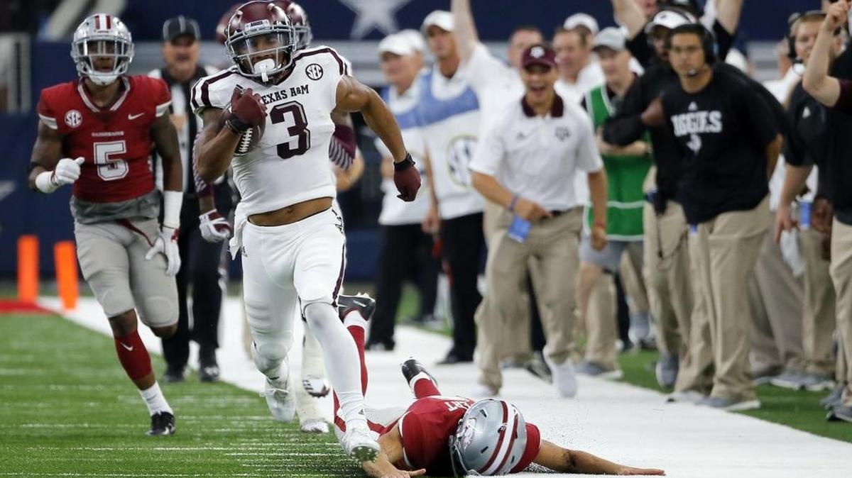 Texas A&M wide receiver Christian Kirk (3) evades Arkansas tackles on a 100-yard kick-off return for a touchdown. Kirk has recently made several early mock draft projections as the Carolina Panthers’ first-round draft pick this spring.