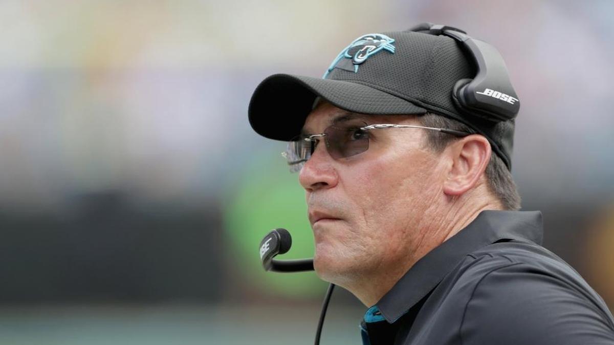 Carolina Panthers head coach Ron Rivera says he hopes the team plays Sunday’s home game as scheduled despite civil unrest in Charlotte, because doing so could help the city heal.