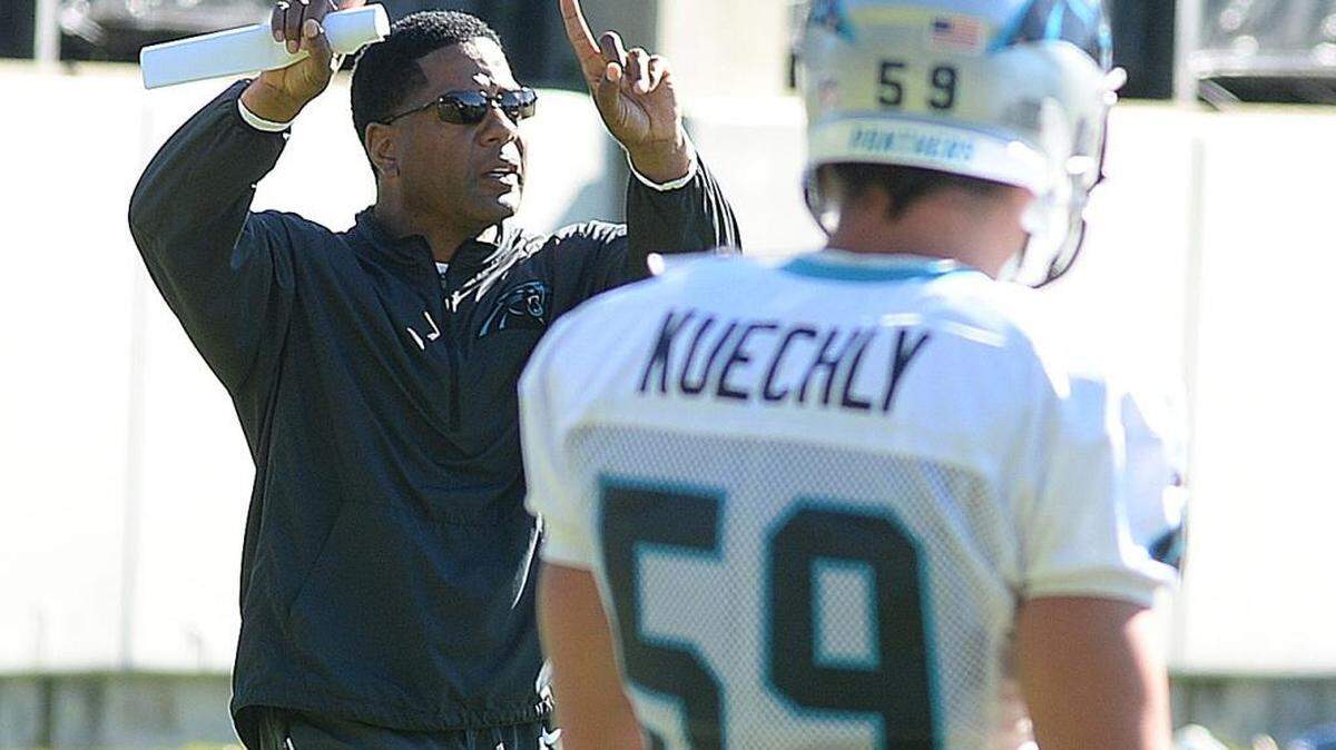 Panthers assistant coach Steve Wilks, left, is a West Charlotte High grad. He will be coaching against another former West Charlotte quarterback, Colts offensive coordinator Pep Hamilton, on Monday night.