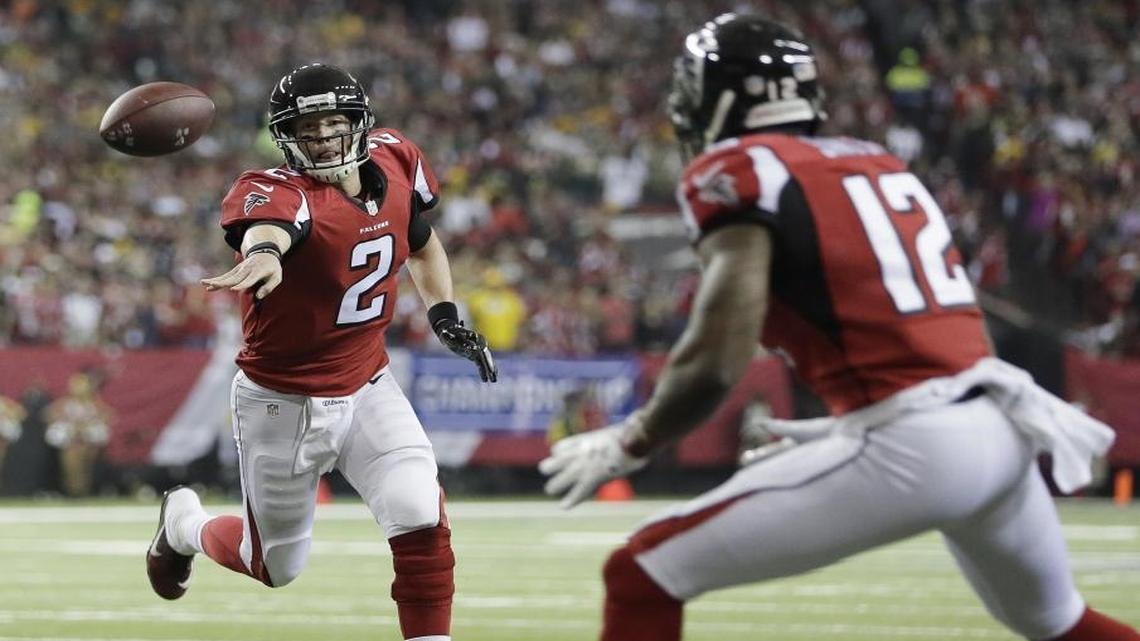 Atlanta Falcons' Matt Ryan throws a touchdown pass to Mohamed Sanu during the first half of Sunday’s NFC championship game.