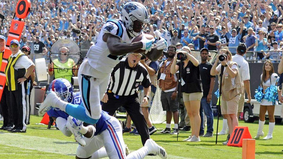 Carolina Panthers wide receiver Curtis Samuel (10) dives past the New York Giants’ Landon Collins (21) for a touchdown in the first half on Sunday, on his first reception of the season.
