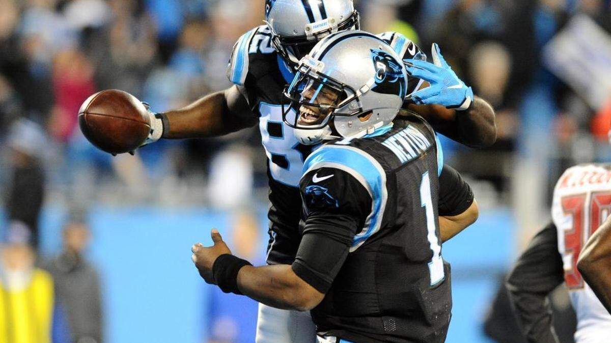 Carolina Panthers quarterback Cam Newton (1) celebrates with Jerricho Cotchery (82) after they connected on a touchdown pass in the second quarter against the Tampa Bay Buccaneers on Sunday. The Panthers won 38-10